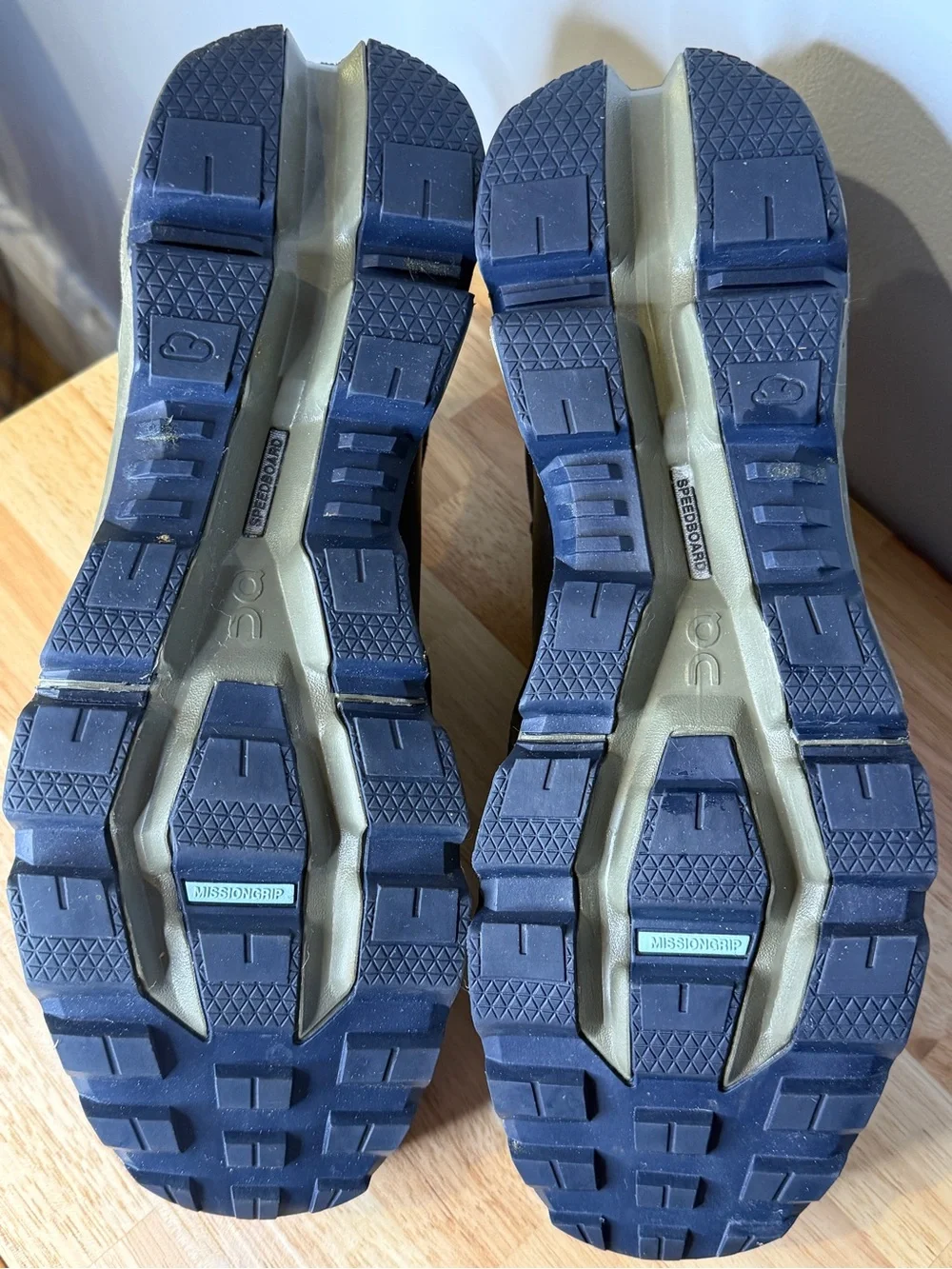 On Waterproof Men's Trail Shoes in midnight blue and Olive